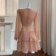 
French niche fashion 2025 design sense hollow rhinestone champagne powder long sleeve V-neck waist-hugging vacation dress for women
