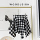 Spring new black and white plaid one-piece lace-up skirt straps covering the cross dance irregular tweed warm skirt