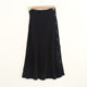 Spring and Autumn Pit knitted half skirt solid color button decoration simple temperament medium long A -line skirt outer single -tail cargo women's clothing