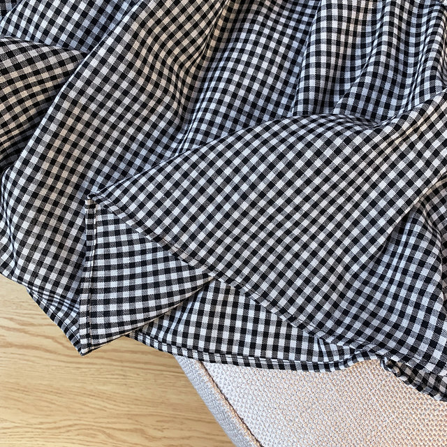 Retro black and white plaid black earring skirt for women in summer irregular A-line thin casual high-waisted long skirt
