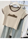 Pink letters jet flower short -sleeved short -sleeved T -shirt 2024 summer new small small shoulder short shoulder short top
