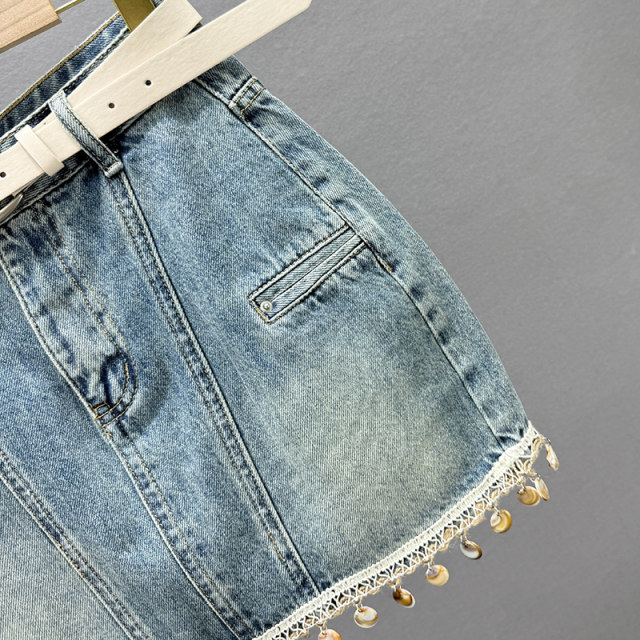 Retro old denim skirt women's short skirt 2025 summer new high-waisted slim tassel A-line hip skirt