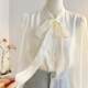 French gentle style lace-up bow long-sleeved shirt for women 2025 spring age-reducing streamer top imitation tiny shirt