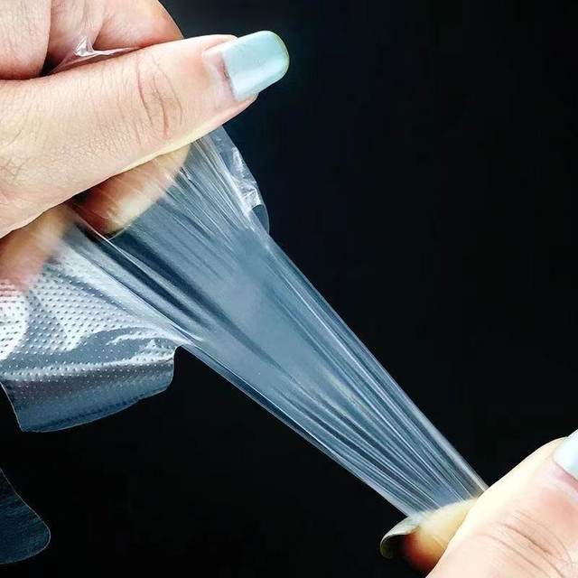 Disposable gloves food grade thickened plastic film transparent catering commercial kitchen hairdressing home protective and durable