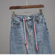 2025 spring and summer lace-up denim skirt for women with high waist elastic hip slit skirt trendy and fashionable mid-length skirt