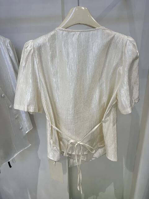 High-end V-neck slanted button short-sleeved shirt for women's summer 2025 new fashionable irregular lace-up waist-closing shirt top
