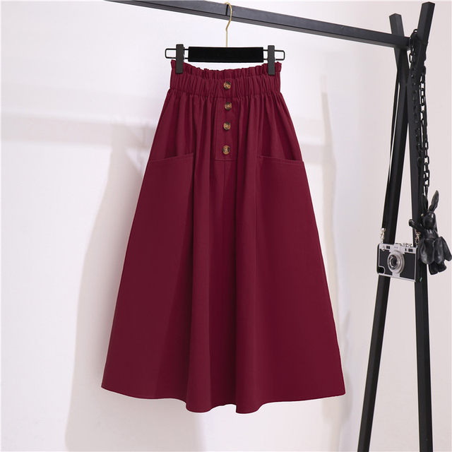 Spring and summer new high -waisted thin waist pine tight waist button decorative pocket design medium long A -line skirt