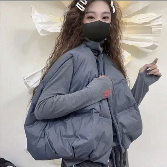 Large -size down cotton vest female autumn new European goods fashion, loose versatile short shoulder vest horses clip top