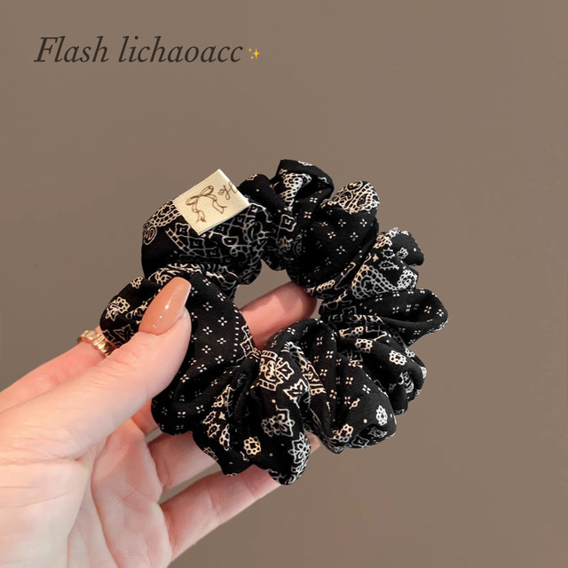 
Retro pattern black small intestine circle high-end texture hair rope headwear 2025 new bow knot ponytail headband