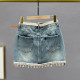 Retro old denim skirt women's short skirt 2025 summer new high-waisted slim tassel A-line hip skirt