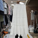 Forest sweet solid color spliced ​​and pleated A-line skirt for women 2025 spring new mid-length fluffy cake skirt