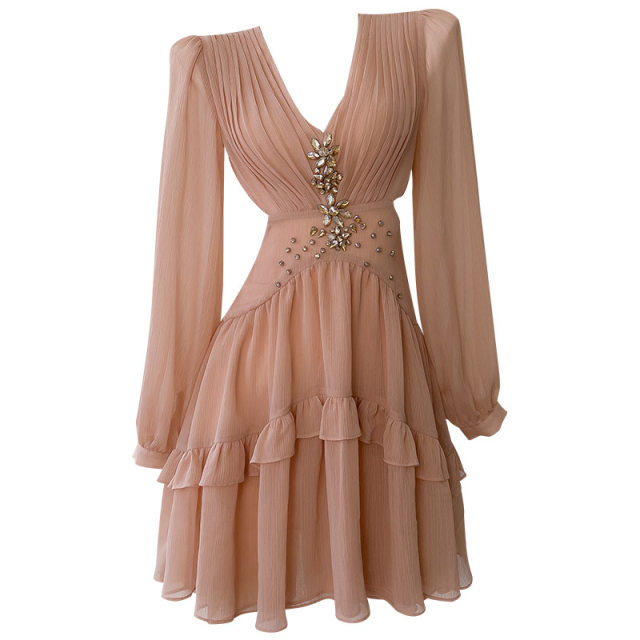 
French niche fashion 2025 design sense hollow rhinestone champagne powder long sleeve V-neck waist-hugging vacation dress for women