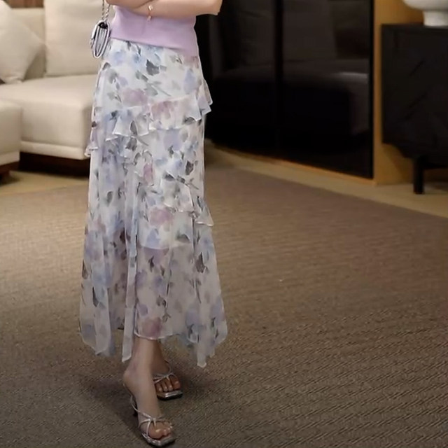 2025 summer new French irregular ruffle print vacation style fashionable age-reducing long skirt for women