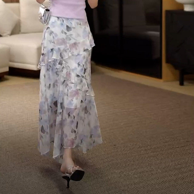 2025 summer new French irregular ruffle print vacation style fashionable age-reducing long skirt for women
