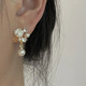 Pearl camellia mosquito coil disc ear clip without piercing women's new high-end flower French style earrings