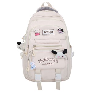 Mid -point two -piece schoolbag Female junior high school students high school elementary school students three to sixth grades solid color large capacity large capacity backpack
