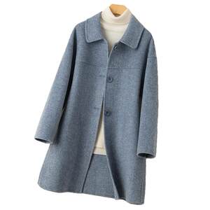 Autumn and winter new double -sided cashmere coat female medium long doll collar loose cocoon -type human character pattern wool coat
