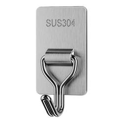 Seamless adhesive hooks on the wall behind the door and load-bearing hooks