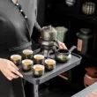 Bộ trà Bộ hộ gia đình than chì lười bán tự động làm trà hiện vật ấm trà gốm Trung Quốc trà kung fu pha trà bếp điện bàn trà Bàn trà điện