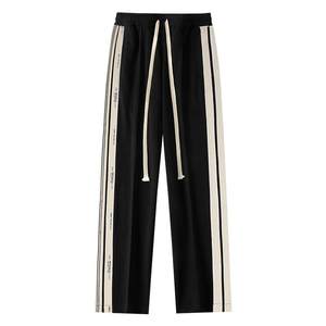 
Coca-Cola/Coca-Cola casual pants for men and women in autumn and winter asymmetric striped trousers plus velvet thickened sports pants