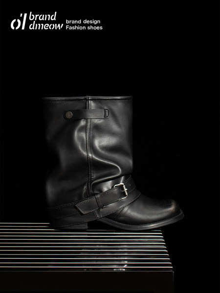 Black leather mid-calf buckle boots displayed on a dark background