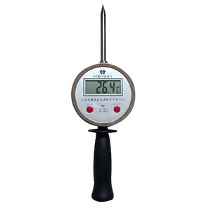 Pattermal number display thermometer showing electronic probe Handheld digital thermometer grain stack of haystack wheat straw stack
