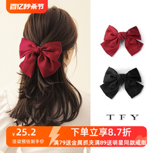 Red large bow clip ins on the back of the head