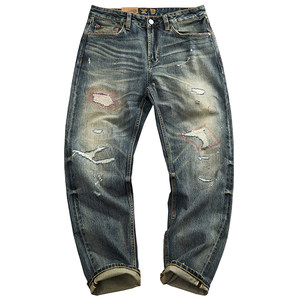 
Heavy American high street trendy high-end selvedge denim jeans for men with distressed patches and embroidery micro-tapered red edge trousers