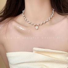 French style pearl camellia necklace for women in 2024, new high-end sensation, internet famous collarbone chain, versatile and trendy for socialite necklaces