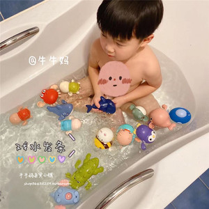 
Children's winding and playing with water and pulling a line toys baby and baby swimming in bathroom cute cartoon crab animals