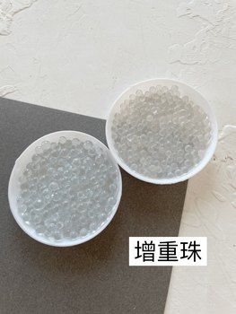 
Doll filled with weight-increasing glass beads