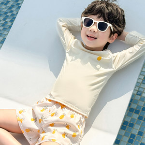 
Children's swimsuits, swimming trunks, new style boys' long-sleeved beach swimming sun protection solid color pineapple split swimsuit swimsuit