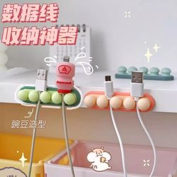Data cable storage holder, charging cable organizer, desktop mobile phone cable hub, cable routing artifact, office organization