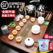 Kunde hộ gia đình đất sét tím kung fu ấm trà nhẹ sang trọng hoàn toàn tự động bếp cảm ứng tích hợp bộ khay trà gỗ nguyên khối và bàn trà