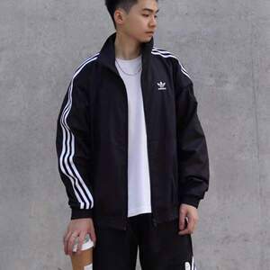 
Adidas clover authentic jackets for men and women 2026 new stand-up collar windproof casual sports jacket JM2716