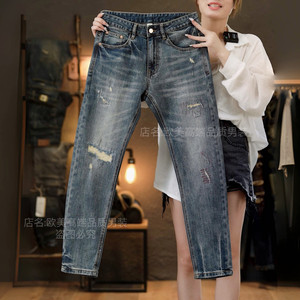 
Autumn and winter new high-end men's retro blue jeans slim fit small feet elastic personalized hole patch trendy brand