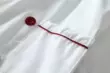 Trang phục mùa hè đồng phục đầu bếp mới áo ngắn tay nhà bếp khách sạn quần áo làm việc nam nữ thoáng khí màu trắng cổ đỏ khách sạn đôi 