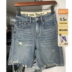 Light blue high waist denim shorts for women with raw edges