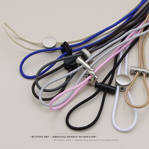 
Elastic cord trousers, hat, down waisted windbreaker, clothes hem, backpack, shoes, elastic cord, metal spring buckle