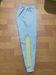 
Custom made pure cotton school uniforms for primary and secondary school students, light gray, three yellow striped stickers, casual sports school pants