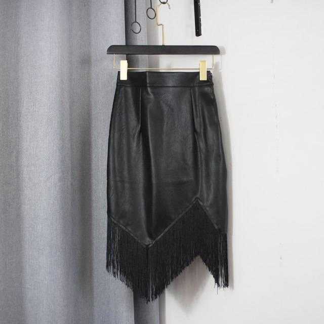 High-waisted hip mid skirt for women in autumn and winter fashion versatile simple irregular tassel slim skirt leather skirt