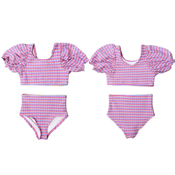 
Fashionable princess girl playing in the seaside triangle swimsuit