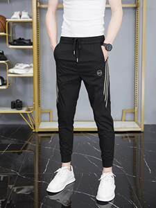 
Spring men's small feet casual pants three-bar sports pants autumn ties nine-point pants trendy black slim harem pants