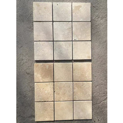 Off-white limestone mosaic floor tiles