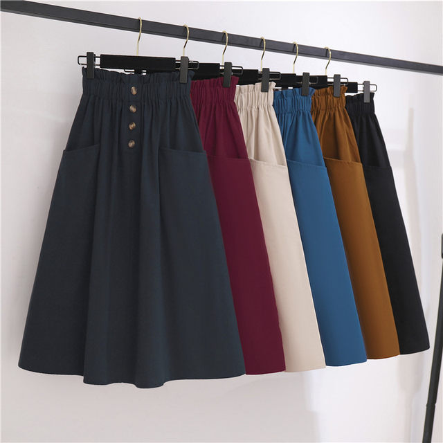 Spring and summer new high -waisted thin waist pine tight waist button decorative pocket design medium long A -line skirt