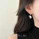 Unique pearl fish tail tassel earrings for women's autumn and winter 2025 new hot style light luxury high-end earrings ear clips