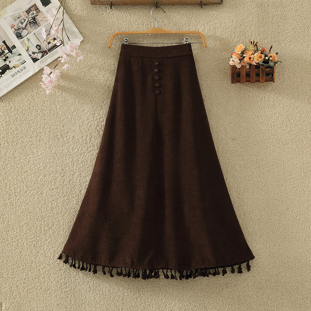 Retro corduroy skirt for women in autumn and winter new high-waisted slim button decorative tassel large a-line sling umbrella skirt