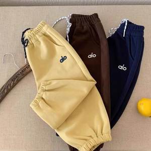 
Children's sports pants solid color spring and autumn new style boys' feet tied casual pants Korean style trendy brand embroidered baby girls' sweatpants