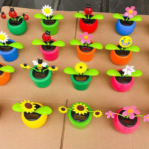 
Factory direct sales night market stall solar toys swinging apple flower car decoration ornaments car small gifts