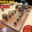 Kungfu đất sét tím bộ ấm trà cho gia đình phòng khách tích hợp khay trà bằng gỗ nguyên khối hoàn toàn tự động đun sôi nước thiết bị lớn bàn trà biển